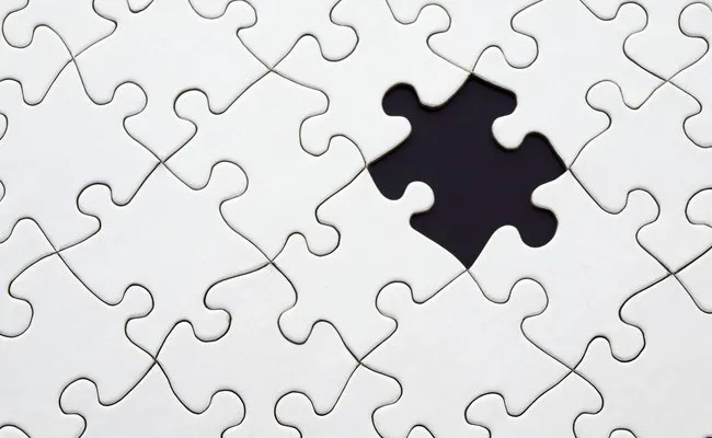 Puzzle with a missing piece.